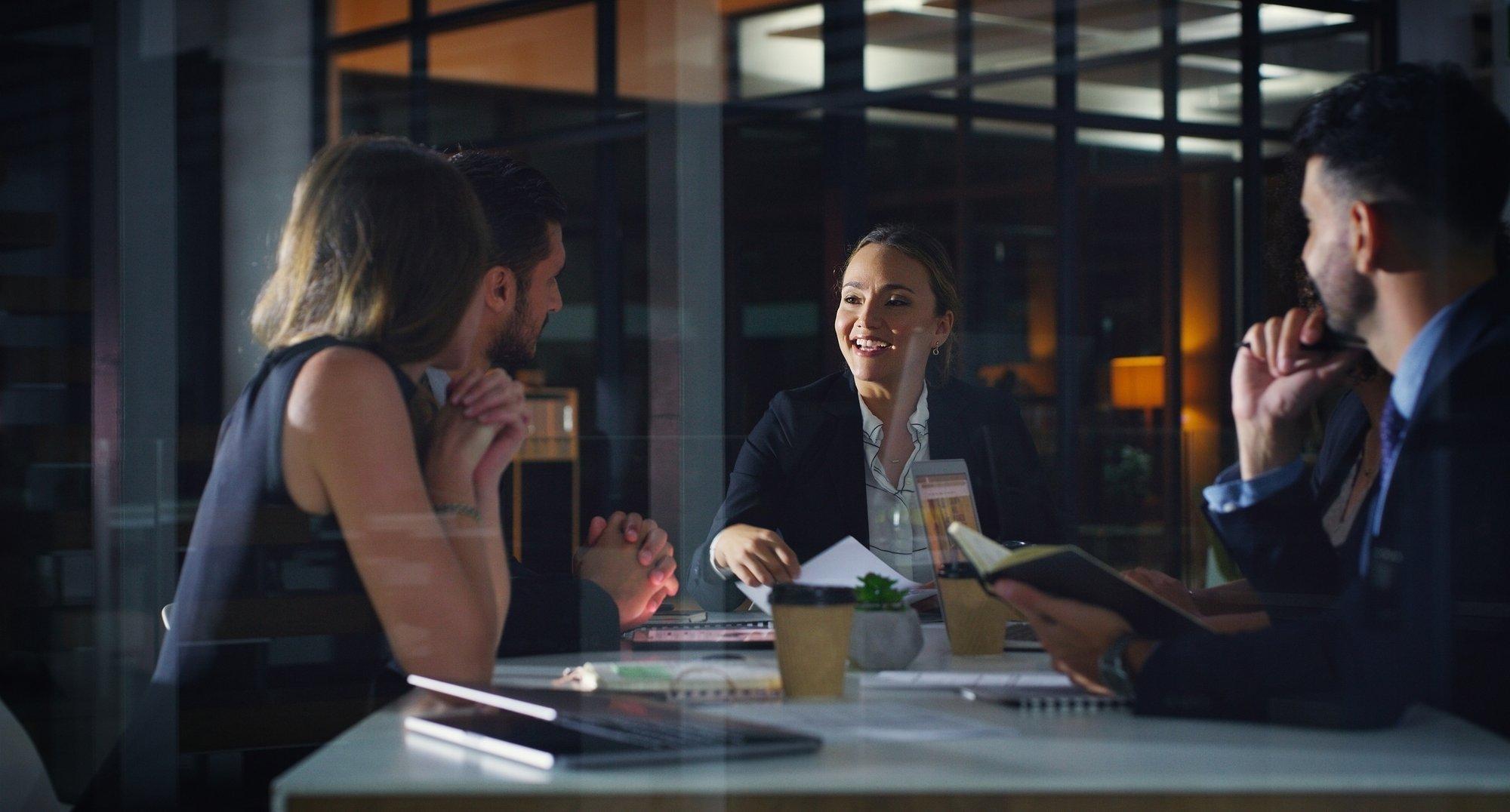 A diverse team collaborating around a meeting table